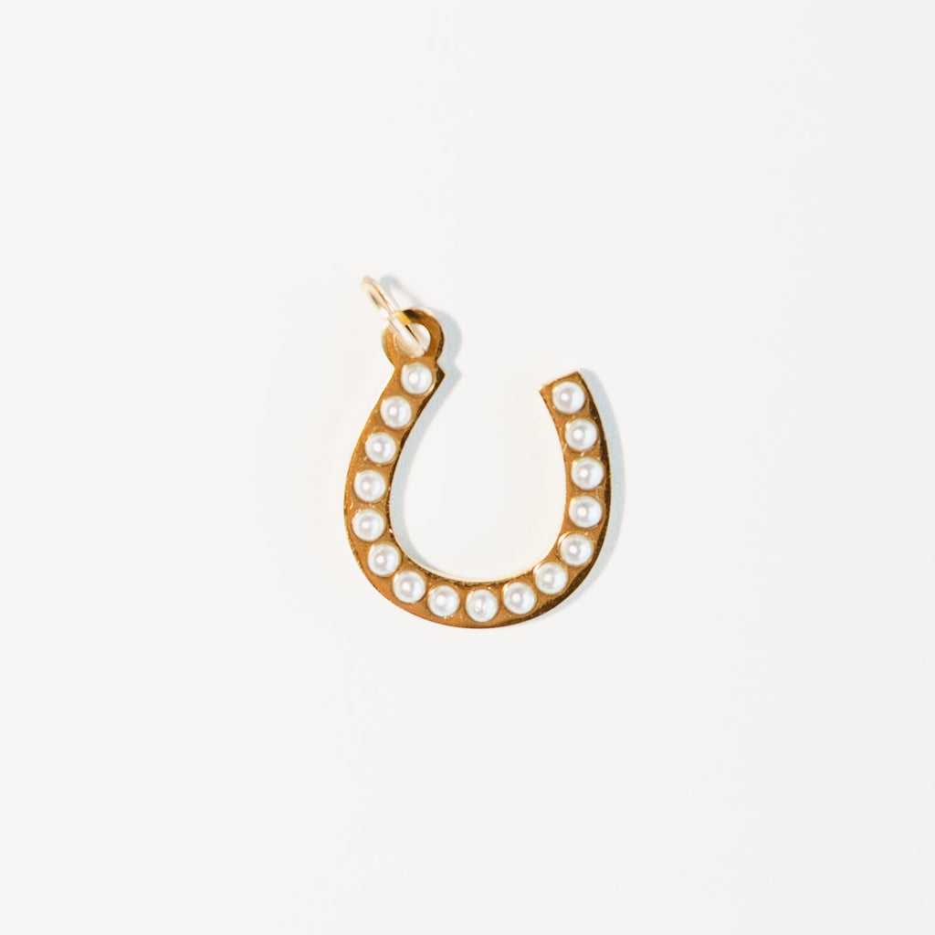 Gold horseshoe charm with pearl